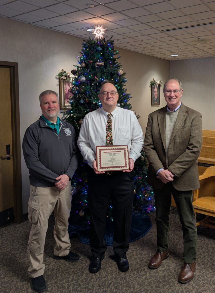 Judge DeLeone, Tim Brown, and Al Barnes with award