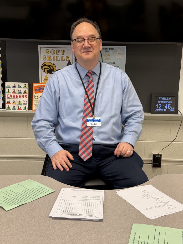 Judge DeLeone sitting at LaMuth Middle School